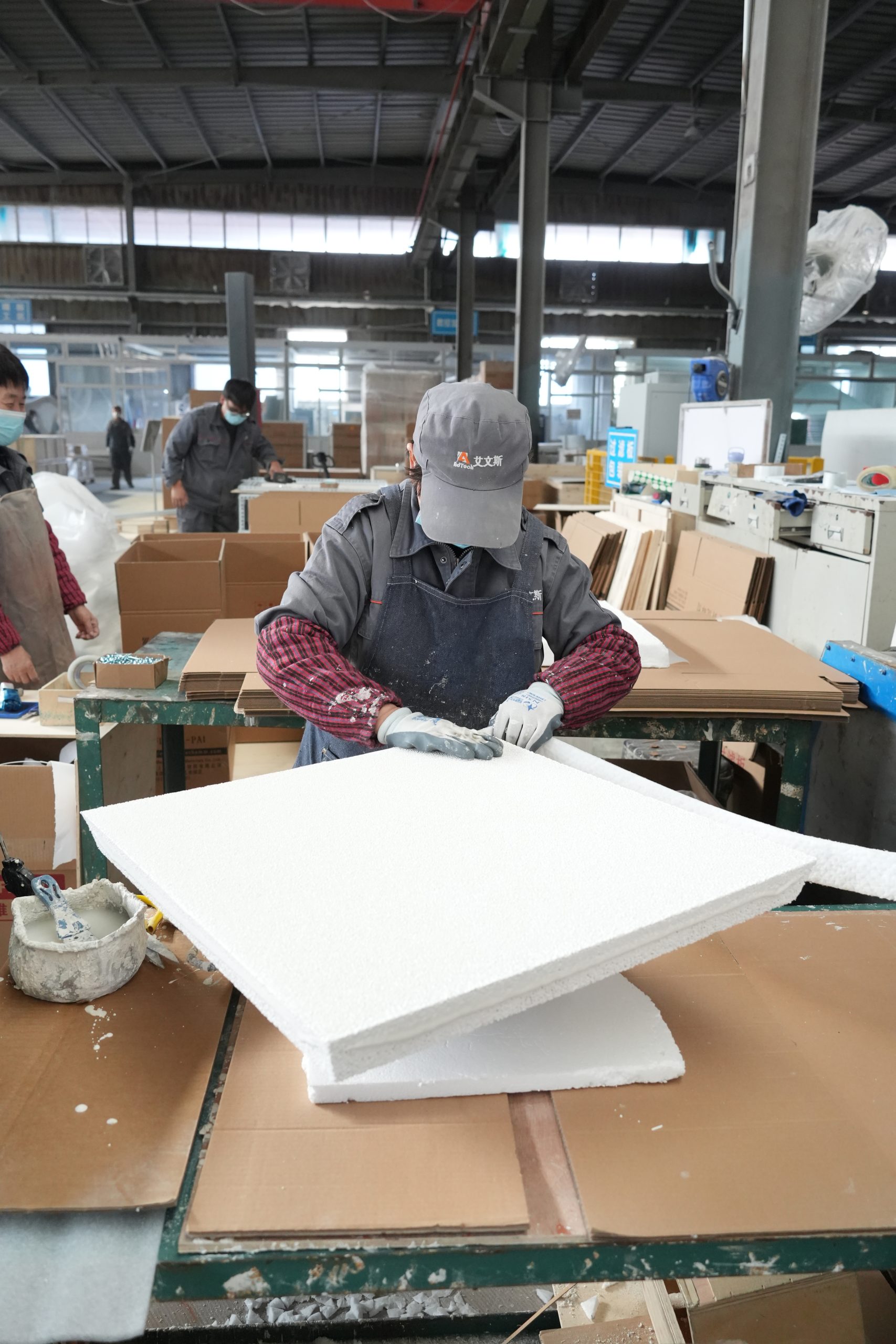 Workers applying CFF edging
